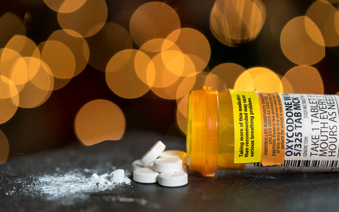 Opioids spilling out of bottle in overdoses