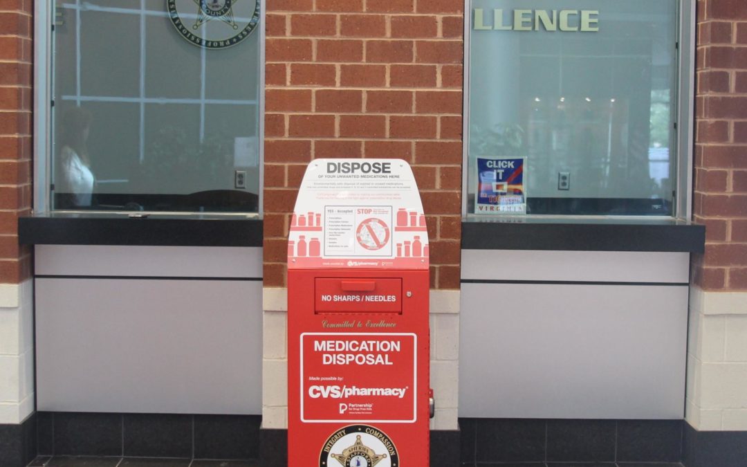 Red medication collection bin outside sheriff's office