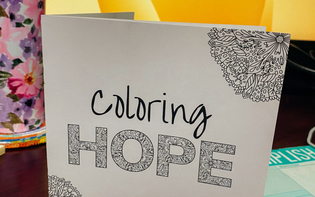 Small booklet that reads "coloring hope"