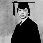 A black and white photo of Inez Beverly Prosser wearing a graduation cap and gown